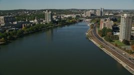 5.5K aerial stock footage flying over Charles River, by office buildings, Boston, Massachusetts Aerial Stock Footage | AX142_057
