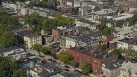 5.5K aerial stock footage flying by row houses, tilt down, South Boston, Massachusetts Aerial Stock Footage | AX142_236