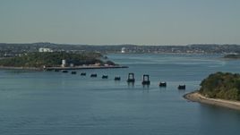 5.5K aerial stock footage flying by unfinished bridge, Moon Island, Boston Harbor, Massachusetts Aerial Stock Footage | AX142_281E
