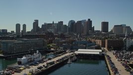 5.5K aerial stock footage flying by wharves, waterfront property, skyline, Downtown Boston, Massachusetts Aerial Stock Footage | AX142_297E