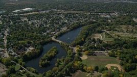 5.5K aerial stock footage flying over small town neighborhoods, Mill Pond, Hyde Park, Massachusetts Aerial Stock Footage | AX142_319E
