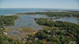 5.5K aerial stock footage flying over forest, approach small coastal community, autumn, Cohasset, Massachusetts Aerial Stock Footage | AX143_024E