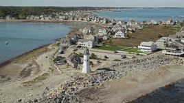 5.5K aerial stock footage orbiting Old Scituate Light, beach, oceanfront homes, Scituate, Massachusetts Aerial Stock Footage | AX143_040E
