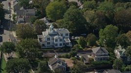 5.5K aerial stock footage flying by large home, small town, Plymouth, Massachusetts Aerial Stock Footage | AX143_097