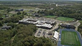 5.5K aerial stock footage flying by Plymouth North High School football practice, Plymouth, Massachusetts Aerial Stock Footage | AX143_102