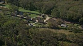 5.5K aerial stock footage orbiting Plimoth Plantation, green trees, Plymouth, Massachusetts Aerial Stock Footage | AX143_106E