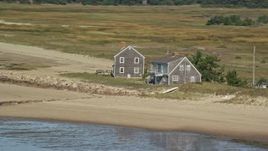 5.5K aerial stock footage flying by isolated beachfront homes, Cape Cod, Eastham, Massachusetts Aerial Stock Footage | AX143_189