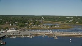 5.5K aerial stock footage flying over Chipman's Cove, approach Wellfleet Town Pier, Wellfleet, Massachusetts Aerial Stock Footage | AX143_195E