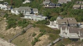 5.5K aerial stock footage flying by homes with ocean views, Cape Cod, Truro, Massachusetts Aerial Stock Footage | AX143_212