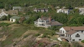 5.5K aerial stock footage flying by homes with ocean views, panning right, Cape Cod, Truro, Massachusetts Aerial Stock Footage | AX143_213