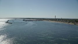 5.5K aerial stock footage approaching piers, small coastal town, Provincetown, Massachusetts Aerial Stock Footage | AX143_221
