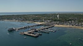 5.5K aerial stock footage orbiting small coastal town, piers, Provincetown, Massachusetts Aerial Stock Footage | AX143_231E