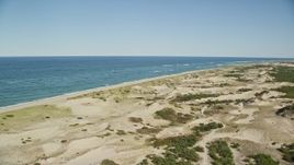 5.5K aerial stock footage flying over sand dunes, beach, Cape Cod, Provincetown, Massachusetts Aerial Stock Footage | AX144_001E
