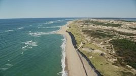 5.5K aerial stock footage flying over waves rolling onto the beach, Cape Cod, Provincetown, Massachusetts Aerial Stock Footage | AX144_004E