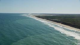 5.5K aerial stock footage panning right, fly by beaches, Nauset Lighthouse, Eastham, Massachusetts Aerial Stock Footage | AX144_030