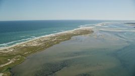 5.5K aerial stock footage flying by marshlands, beaches, sand bars at low tide, Orleans, Massachusetts Aerial Stock Footage | AX144_042E