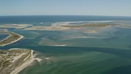 5.5K aerial stock footage flying by Monomoy Island, sands bars at low tide, Chatham, Massachusetts Aerial Stock Footage | AX144_054E