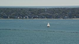 5.5K aerial stock footage flying by small island town, sailboats on water, Nantucket, Massachusetts Aerial Stock Footage | AX144_074
