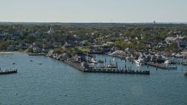 5.5K aerial stock footage flying by coastal community, piers, Nantucket, Massachusetts Aerial Stock Footage | AX144_079E