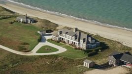 5.5K aerial stock footage flying by an upscale beachfront home, Nantucket, Massachusetts Aerial Stock Footage | AX144_111