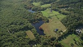 5.5K aerial stock footage over rural homes, approach ponds, West Tisbury, Martha's Vineyard, Massachusetts Aerial Stock Footage | AX144_156E