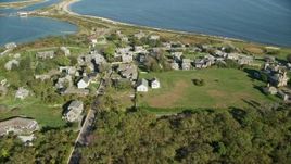 5.5K aerial stock footage orbiting coastal community, Cuttyhunk Island, Elisabeth Islands, Massachusetts Aerial Stock Footage | AX144_175