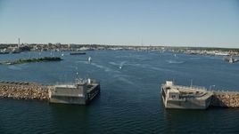 6k aerial stock footage approaching harbor, Palmer Island Light and New Bedford, Massachusetts Aerial Stock Footage | AX144_190E