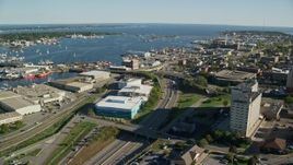 6k aerial stock footage flying by harbor, waterfront warehouses, New Bedford, Massachusetts Aerial Stock Footage | AX144_199
