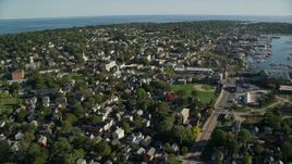 6k aerial stock footage flying by coastal community, harbor in the distance, Newport, Rhode Island Aerial Stock Footage | AX144_229E