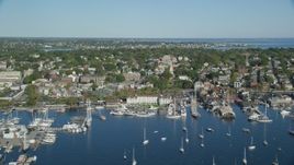 6k aerial stock footage flying by coastal community, piers, busy harbor, Newport, Rhode Island Aerial Stock Footage | AX144_232