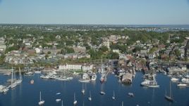6k aerial stock footage orbiting coastal community, piers, Newport, Rhode Island Aerial Stock Footage | AX144_233