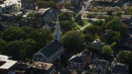6k aerial stock footage orbiting Trinity Church, quiet neighborhood, Newport, Rhode Island Aerial Stock Footage | AX144_237
