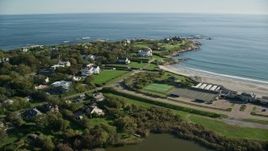 6k aerial stock footage flying by coastal community, approach oceanfront mansion, Newport, Rhode Island Aerial Stock Footage | AX144_248E