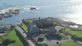 6k aerial stock footage orbiting oceanfront mansion, coastal cliffs, Newport, Rhode Island Aerial Stock Footage | AX144_250