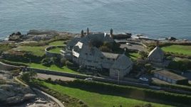 6k aerial stock footage orbiting oceanfront mansion, coastal cliffs, Newport, Rhode Island Aerial Stock Footage | AX144_250E