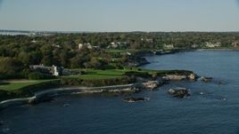 6k aerial stock footage flying by oceanfront mansion, green lawns, Newport, Rhode Island Aerial Stock Footage | AX144_254