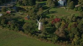 6k aerial stock footage approaching a windmill, tilt down, Portsmouth, Rhode Island Aerial Stock Footage | AX145_003