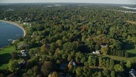 6k aerial stock footage flying over homes near the shore, colorful trees, Barrington, Rhode Island Aerial Stock Footage | AX145_017E