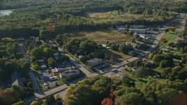 6k aerial stock footage flying by Wampanoag Trail, dense trees, Barrington, Rhode Island Aerial Stock Footage | AX145_023E