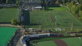 6k aerial stock footage approaching a football practice, tilt down, Brown University, Providence, Rhode Island Aerial Stock Footage | AX145_065