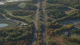 6k aerial stock footage flying by Interstate 495, autumn, Plainville, Massachusetts Aerial Stock Footage | AX145_107