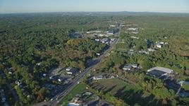 6k aerial stock footage flying over Boston Providence Highway, warehouses, autumn, Walpole, Massachusetts Aerial Stock Footage | AX145_120