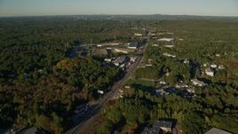 6k aerial stock footage flying over Boston Providence Highway, warehouses, autumn, Walpole, Massachusetts Aerial Stock Footage | AX145_120E