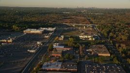 6k aerial stock footage flying by office buildings, warehouses, autumn, Westwood, Massachusetts, sunset Aerial Stock Footage | AX146_001E