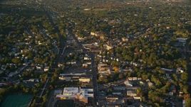 6k aerial stock footage flying over Hyde Park Avenue near church, school and homes, autumn, Hyde Park, Massachusetts, sunset Aerial Stock Footage | AX146_006E