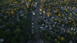 6k aerial stock footage of a bird's eye view, suburban neighborhood, autumn, Roslindale, Massachusetts, sunset Aerial Stock Footage | AX146_009