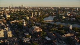 6k aerial stock footage orbiting Harvard University, reveal Charles River, Cambridge, Massachusetts, sunset Aerial Stock Footage | AX146_021