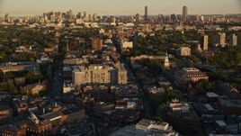 6k aerial stock footage of Harvard University, downtown skyline, Downtown Boston, Massachusetts, sunset Aerial Stock Footage | AX146_032E