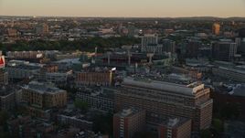 6k aerial stock footage approaching Fenway Park, Massachusetts, sunset Aerial Stock Footage | AX146_050