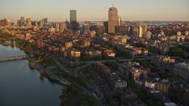 6k aerial stock footage flying by Back Bay and skyscrapers, Downtown Boston, Massachusetts, sunset Aerial Stock Footage | AX146_060